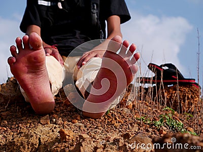 Boy feet front image at natural sky filed Stock Photo