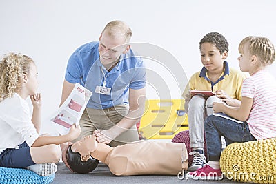 Boy with first aid instruction Stock Photo