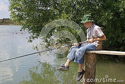 The boy with a fishing tackle Stock Photo