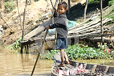 Boy in floating village in Cambodia Editorial Stock Photo