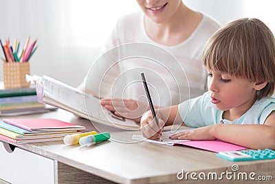 Boy focusing on homework Stock Photo