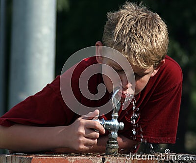 Boy At Fountain Stock Photo