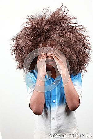 A boy with a funky hairstyle Stock Photo