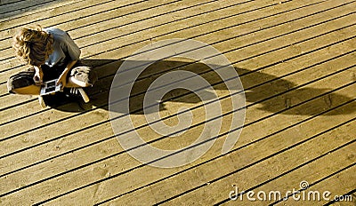 Boy gamer on decking Stock Photo