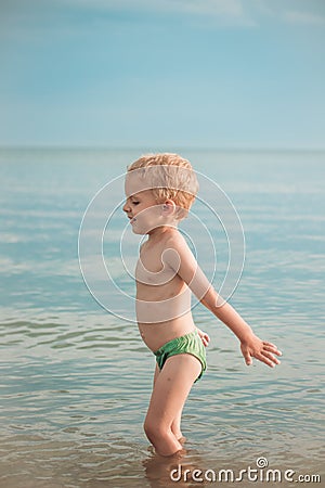 Boy getting ready to jump to dive deep Stock Photo