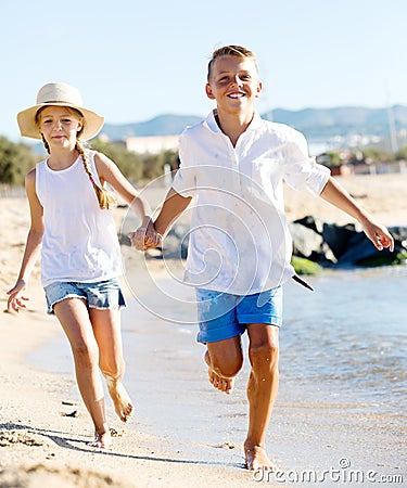 Boy and girl actively jogging together Stock Photo