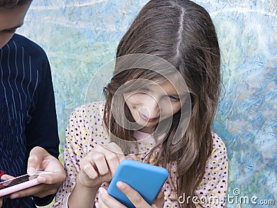 Children Busy With Mobile Phones Stock Photo