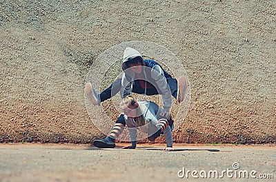 Boy and girl dancing break dance on the street Stock Photo