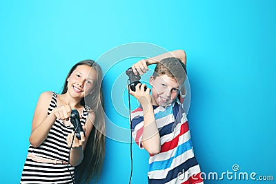 Boy and girl with joysticks Stock Photo