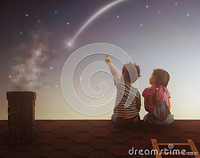 Boy and girl make a wish Stock Photo