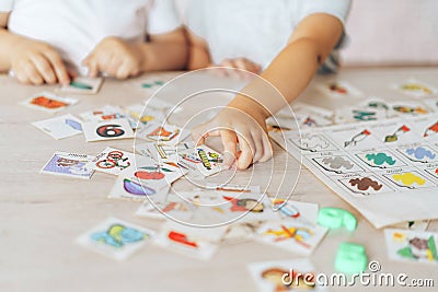 Boy and girl play educational games at school desk Stock Photo