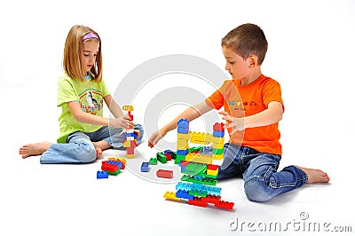 Boy and Girl playing with constructor Stock Photo