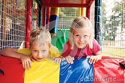 Boy and girl playing in the maze Stock Photo