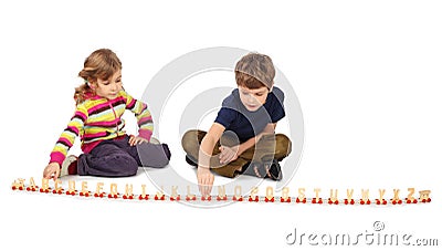 Boy and girl playing with wooden railway Stock Photo