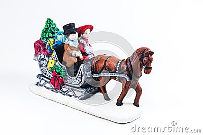 boy and girl riding the Horsecar ,Christmas decoration ceramics, earthenware isolated on white background... Stock Photo