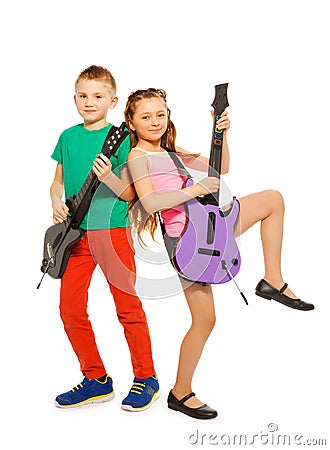 Boy and girl rock together playing on guitars Stock Photo