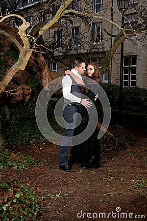 Boy and girl in Victorian clothing in the park Stock Photo