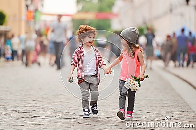 Boy and girl walking on the street Stock Photo