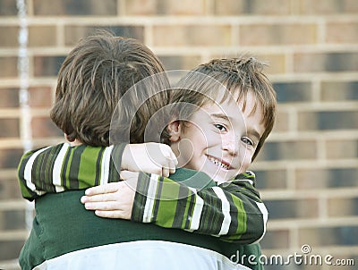 Boy Giving a Hug Stock Photo