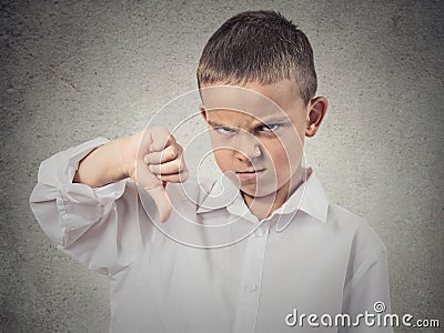 Boy Giving Thumbs Down Gesture Stock Photo