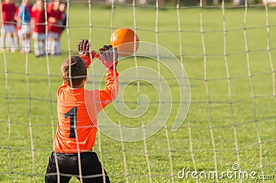 Boy goalkeeper defends Stock Photo