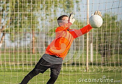 Boy goalkeeper defends Stock Photo