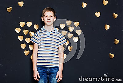 Boy with golden heart wings Stock Photo