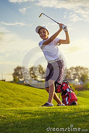 Boy playing golf Stock Photo