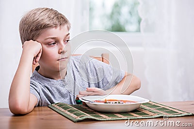 Boy having no appetite Stock Photo