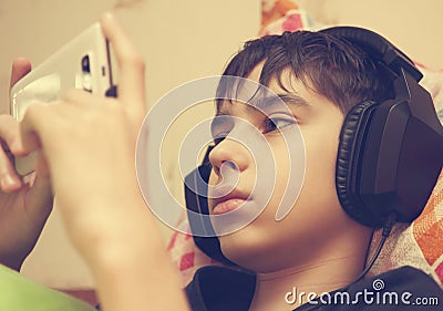 Boy with headphones and smart phone Stock Photo