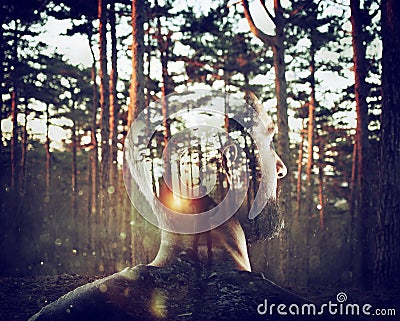 Boy with himself in mind in a forest. Double exposure Stock Photo