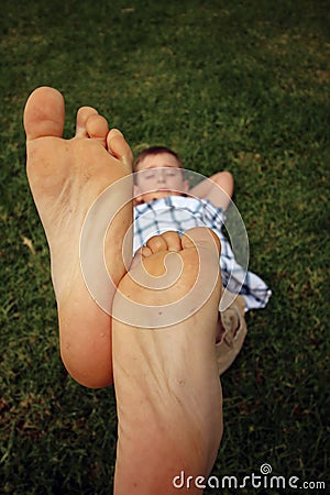 Boy with his feet together in the air Stock Photo