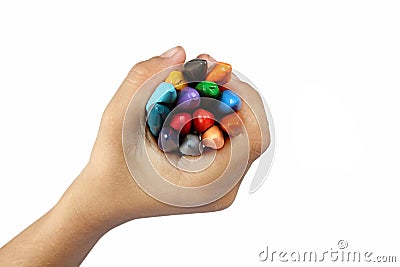 Boy holding crayons Stock Photo