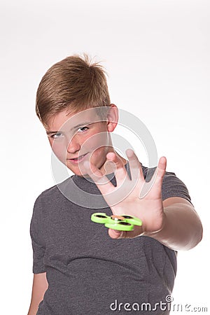 Boy holding fidget spinner Stock Photo
