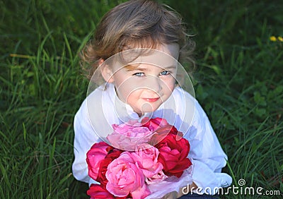 Boy holding flowers Stock Photo