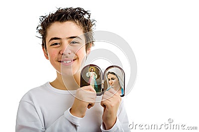 Boy holding Merciful Jesus and Our Lady of Medjugorje icon Stock Photo