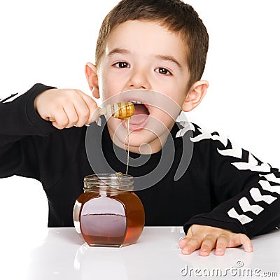 Boy and honey Stock Photo
