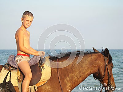 Boy on horseback Stock Photo