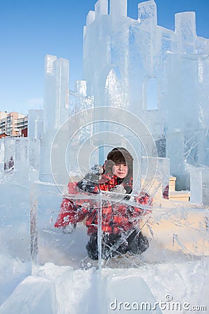 Boy with an ice sculpture, urban esp Stock Photo