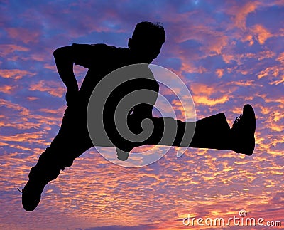 Boy jumping high in the air Stock Photo