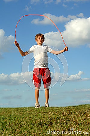 Boy jumping rope Stock Photo