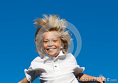 Boy jumping on a trampoline Stock Photo