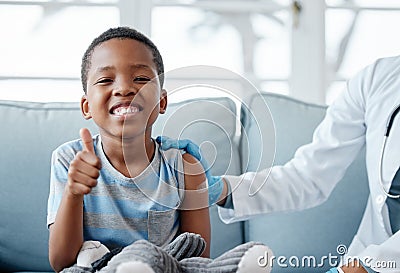 Boy kid, thumbs up and injection with smile in portrait, plaster and medicine for wellness in hospital. Male child Stock Photo