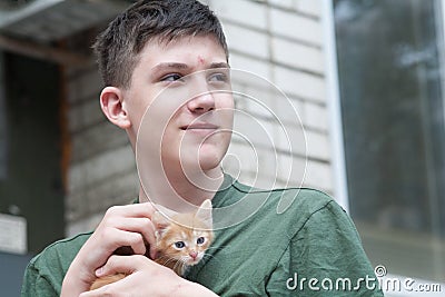 A boy and a kitten, a guy and a kitten Stock Photo