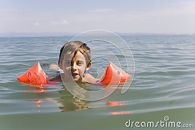 Boy learns swiming Stock Photo