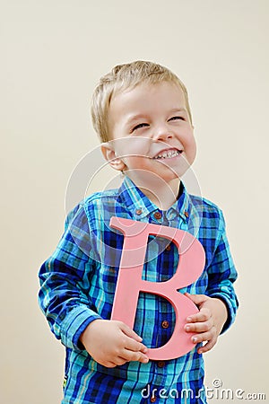 Boy with letter b Stock Photo