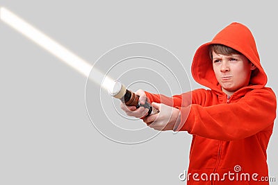 Boy with lightsaber Stock Photo