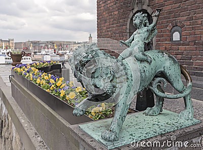 Boy on a lion from Stockholm Town Hall Stock Photo