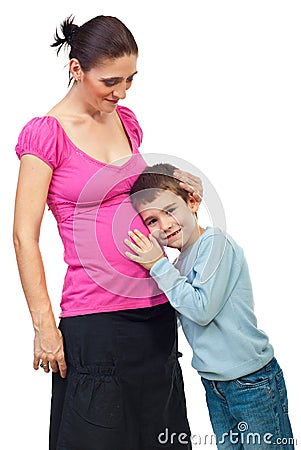 Boy listen her mother pregnant tummy Stock Photo