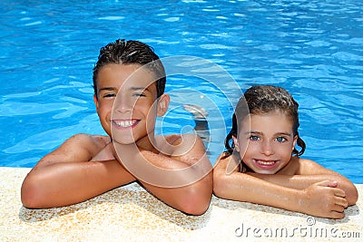 Boy and little girl summer vacation in pool Stock Photo